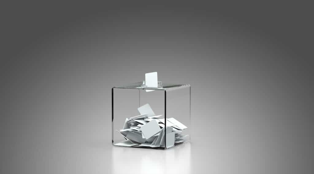 Clear cube with folder papers; Parlimentary Procedure Voting